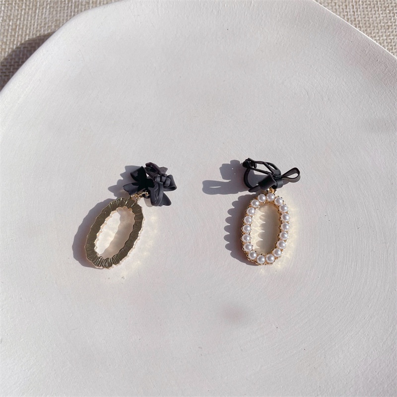 Khuyên tai kẹp không bấm lỗ chốt cố định K196 bằng hợp kim phủ màu hình elip đính nơ hạt trai dáng midi Leous