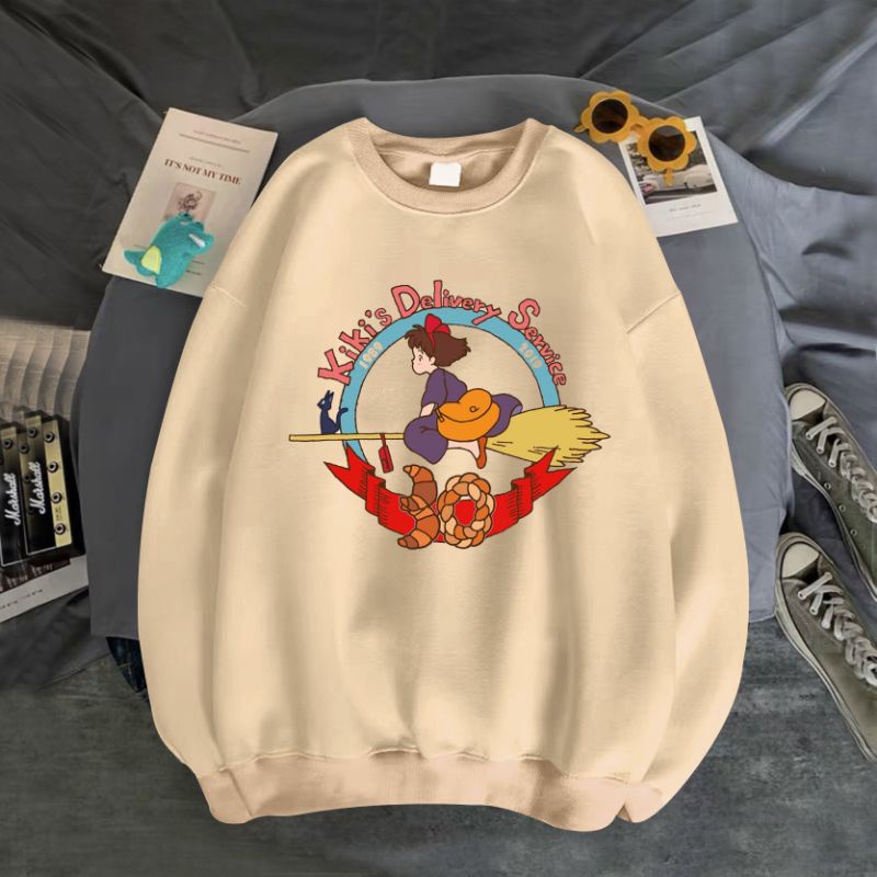 ÁO SWEATER UNISEX NỈ BÔNG IN KIKI CƯỠI CHỔI