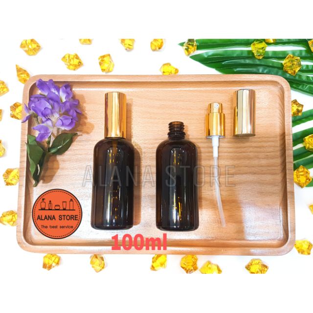 Lọ thủy tinh nâu vòi bơm nhôm vàng 100ml