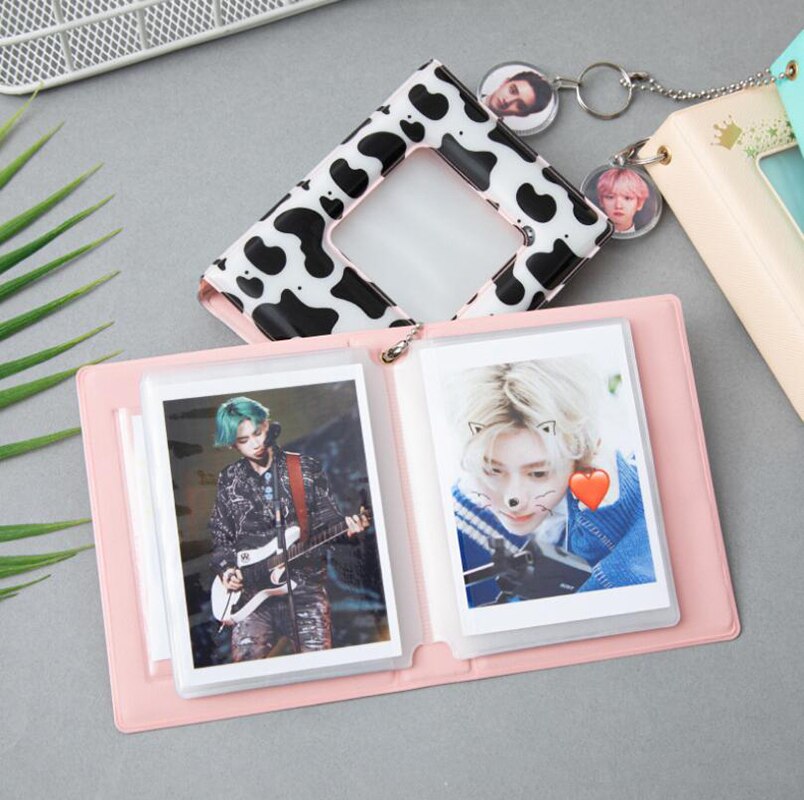 Album Ảnh 32 Ngăn 3 inch Màu Trắng Đen Hình Bò Và Ngôi Sao KPOP Giá Đỡ