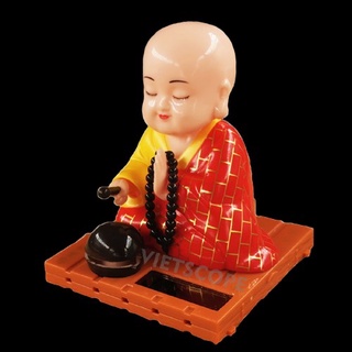 Tượng chú tiểu gõ mõ, tụng kinh bằng năng lượng mặt trời