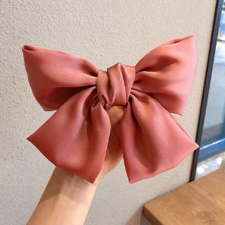 Kẹp tóc phối họa tiết nơ dễ thương cho nữ