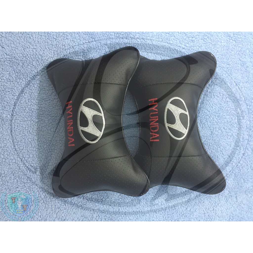Gối tựa đầu bằng da cho ghế xe ô tô có gắn logo của các hãng xe | BigBuy360 - bigbuy360.vn