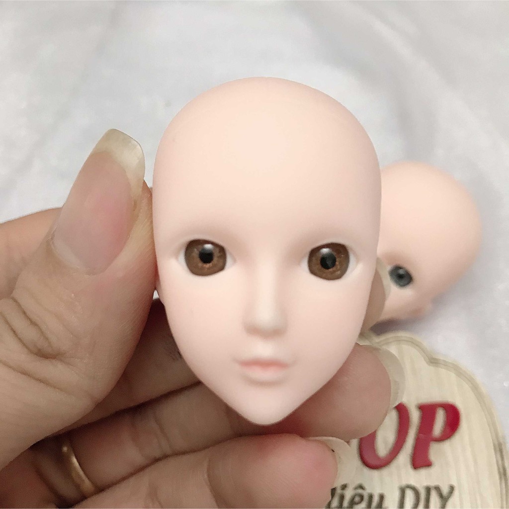 Đầu búp bê xinyi mắt gắn chưa faceup không tóc