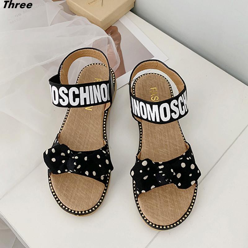 Women's shoes, sandals, fashion bow, women's all-match flat elastic band Korean version of non-slip Roman women's beach shoes