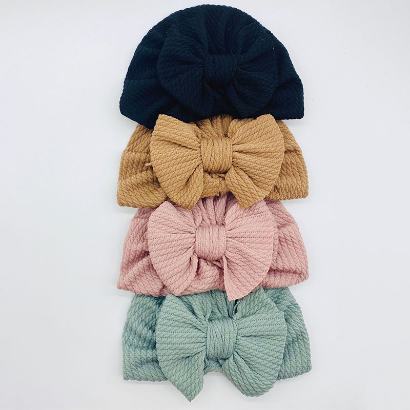 Mũ beanie mềm co giãn màu trơn đính nơ thời trang thu đông cho bé tùy chọn màu sắc