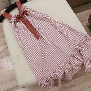 Đầm caro hồng nơ ngực