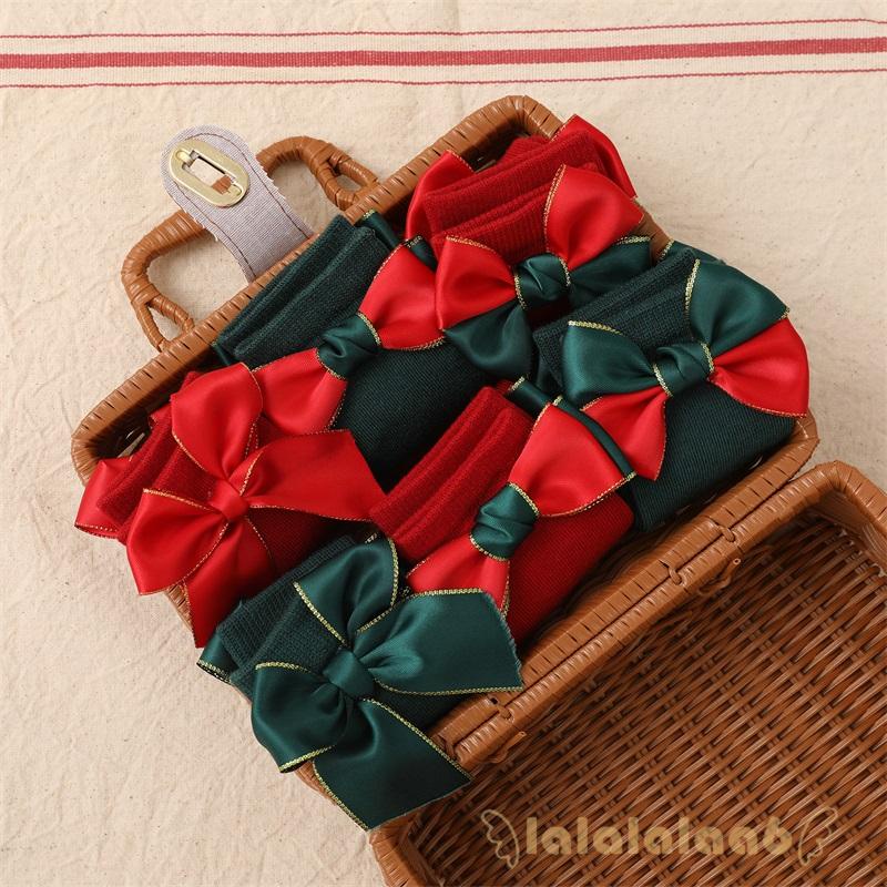 Set 2 đôi vớ dài trung bình đính nơ trang trí Giáng Sinh cho bé