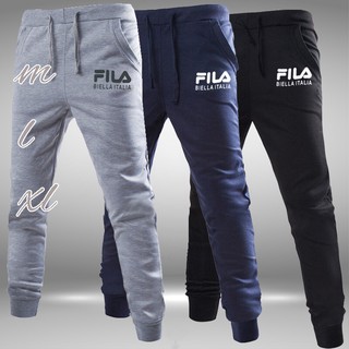 Quần thể thao nam nữ Fila kem hình thât