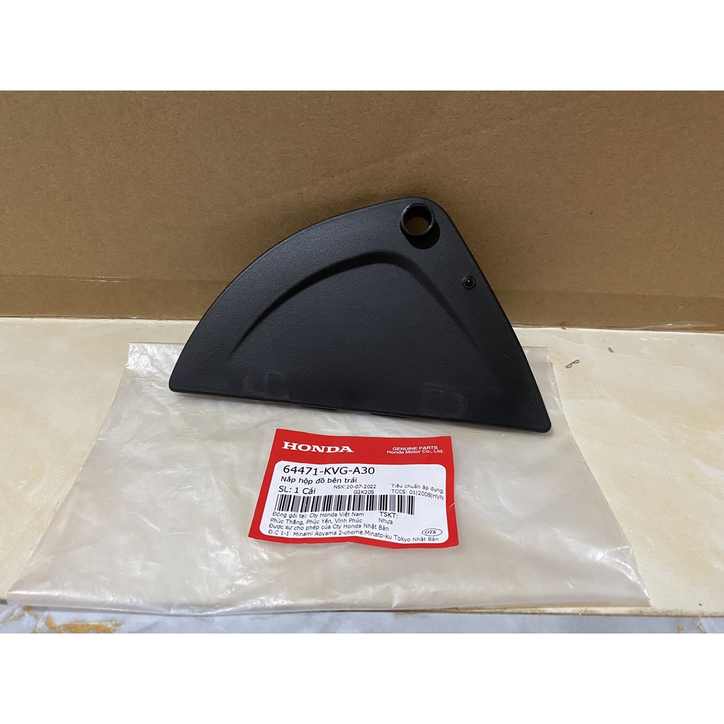 Nắp hộp đồ bên trái HONDA AIR BLADE 110 FI năm 2009-2010. 64471KVGA30