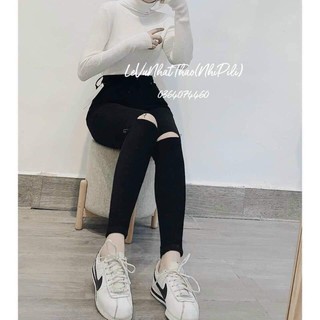 Quần bò đen rách gối
