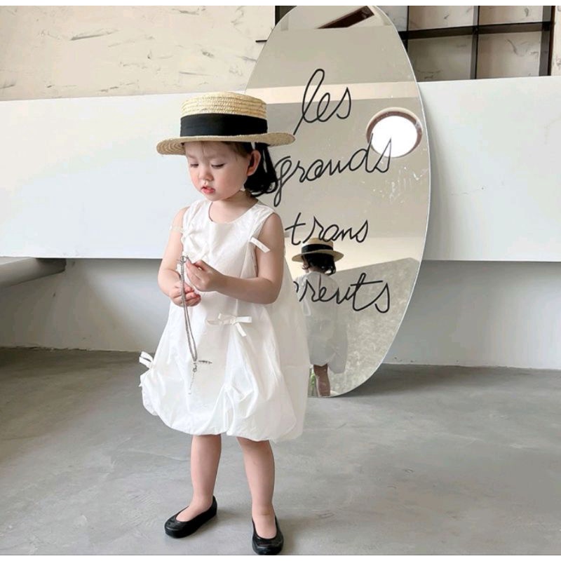 Đầm bí trắng nơ nhí