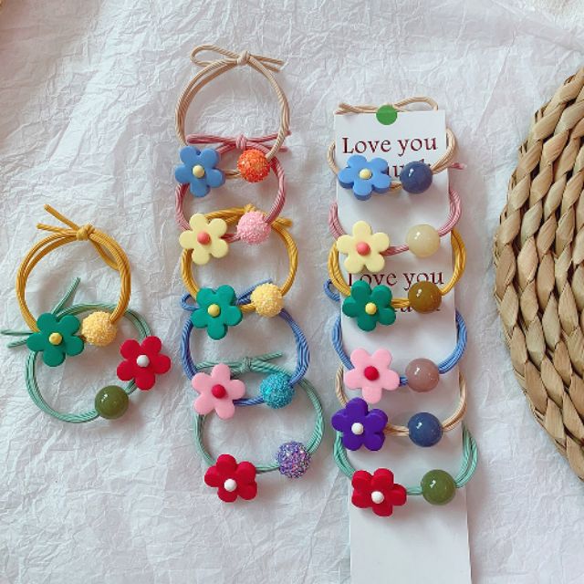 Dây buộc tóc một bông hoa + một viên đá sắc màu