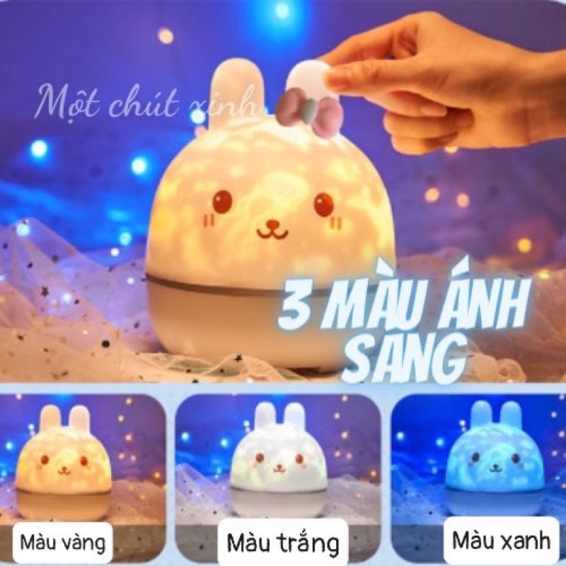 Đèn ngủ chiếu sao thỏ cài nơ hồng có 12 set chiếu chính hãng Onefire ❌Freeship❌ Đèn ngủ ngàn sao 3D Một Chút Xinh