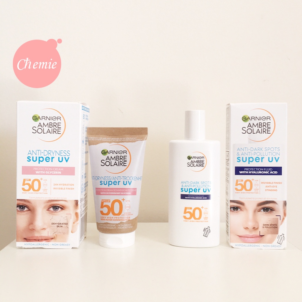 Kem chống nắng Garnier Ambre Solaire Super UV SPF50+ skin fluid against pigment spots 40 ml/Garnier anti-dryness 50ml