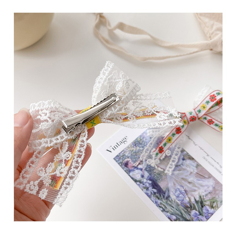 Kẹp nơ ren trắng họa tiết cổ điển KEP06