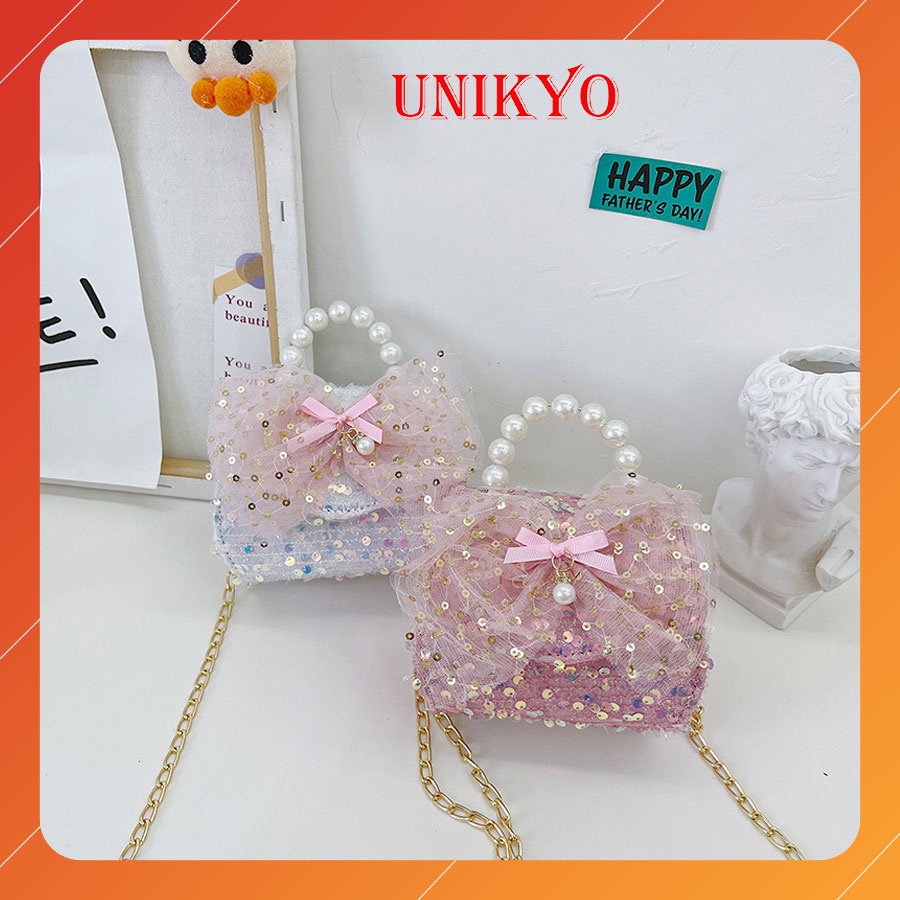 Túi xách đeo chéo cho bé gái trẻ em có nơ lấp lánh mini quai ngọc dễ thương xinh xắn đáng yêu siêu bền đẹp Unikyo UN53