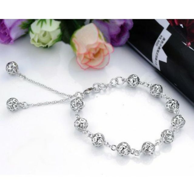 Lắc tay nữ inox kiểu trái châu thời trang