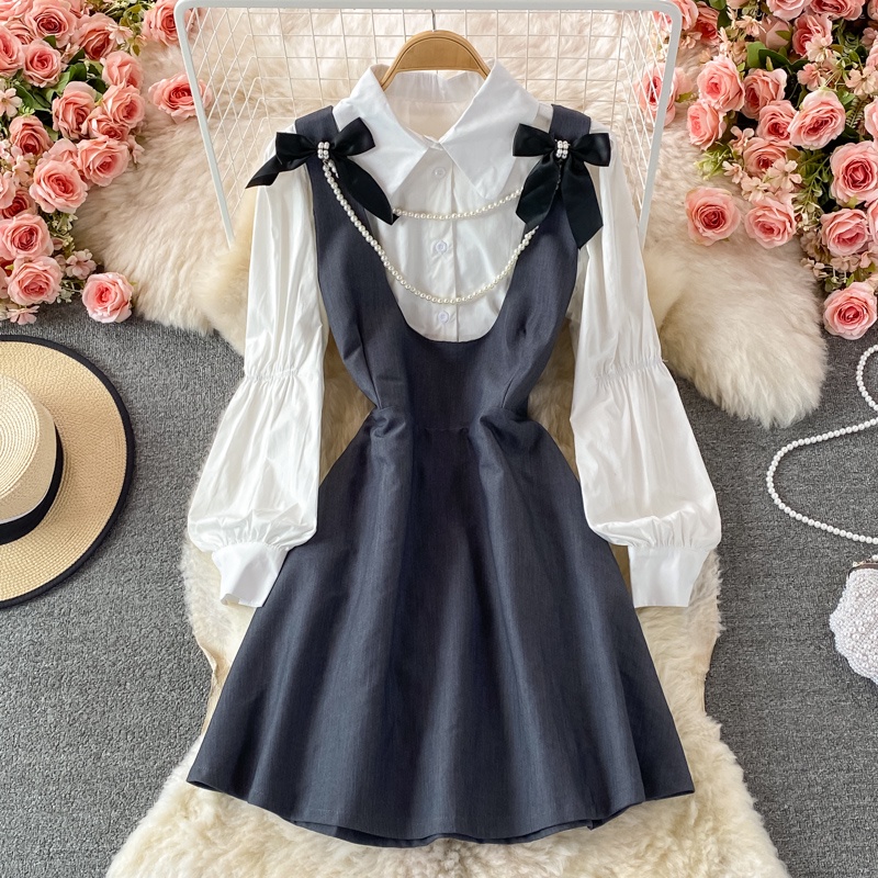2021 Mùa thu Pháp Retro Cô gái Bowknot Dress Puff Sleeve Áo sơ mi trắng Top Strap Skirt Bộ hai mảnh