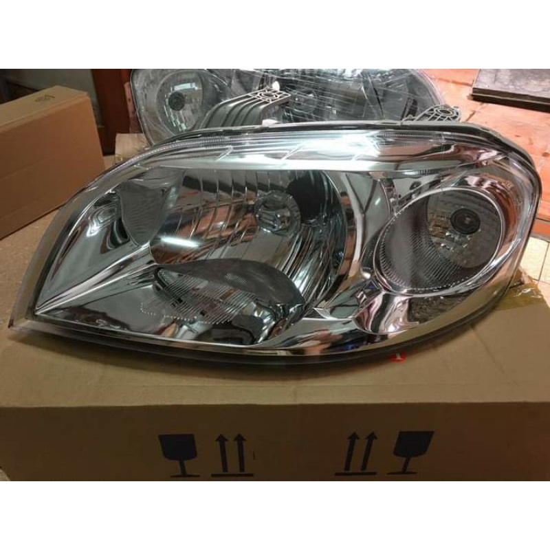 Đèn pha/ đèn lái trước Gentra - Phụ tùng XE CỎ