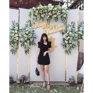 Đầm đen tay phồng xéo ngực