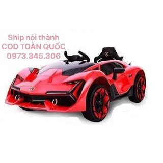 Siêu xe ô tô điện trẻ em NEL 603  cánh mở chéo ghế ngồi rộng ĐỎ-CAM-TRẮNG BẢO HÀNH 06 THÁNG