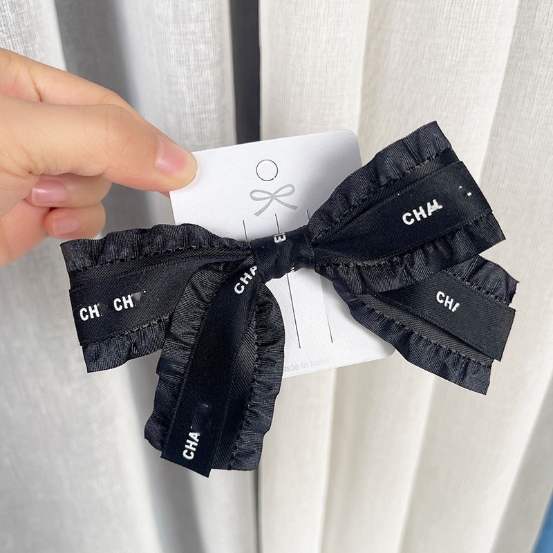 Kẹp nơ viền bèo phối chữ đen trắng sang chảnh N56