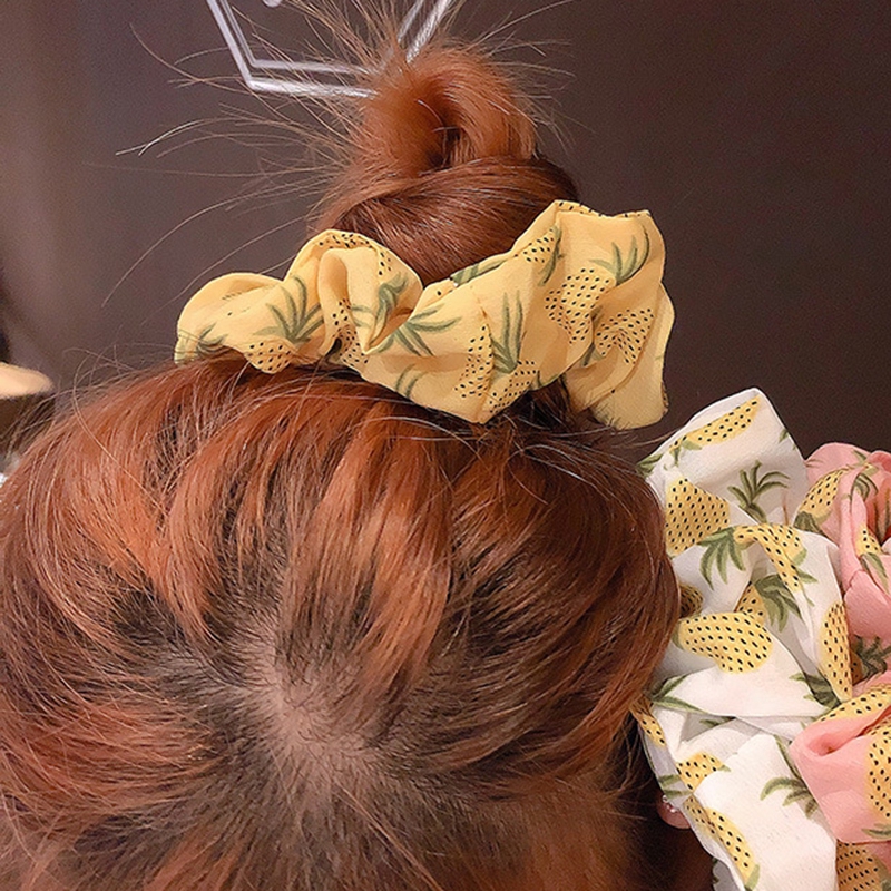 Thun cột tóc hình trái dừa phong cách thời trang dễ thương cho phái nữ