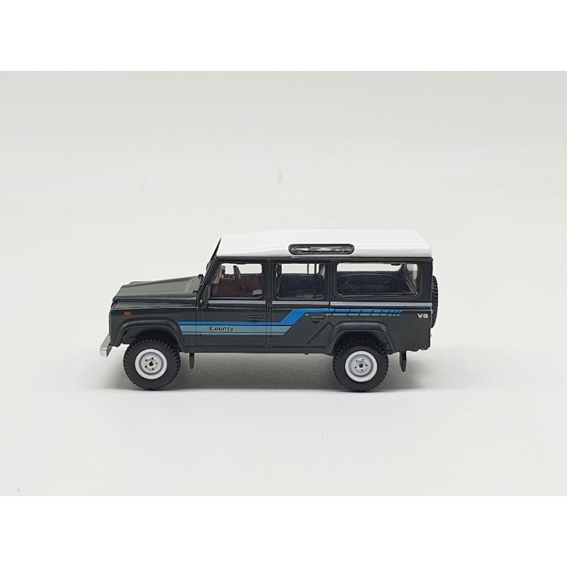 Xe Mô Hình Land Rover Defender 1985 County Station Wagon Grey RHD 1:64 Mini GT (Đen)