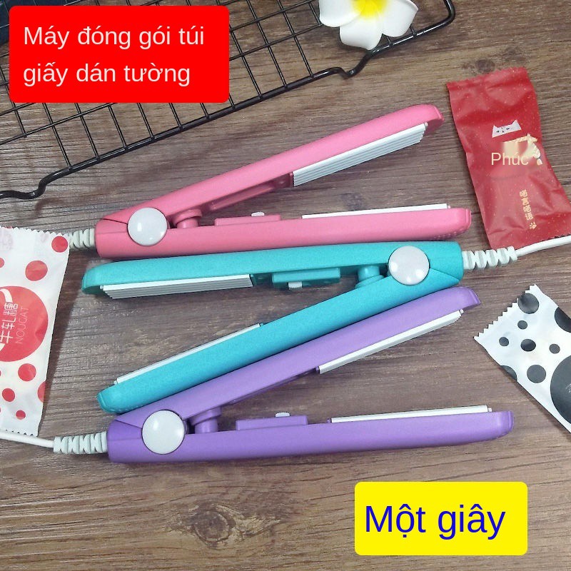 Máy đóng dấu nhỏ gia dụng mini ép tay cầm kẹo hạnh phúc gói bánh ngọt đường giấy nhựa niêm phong nhiệt