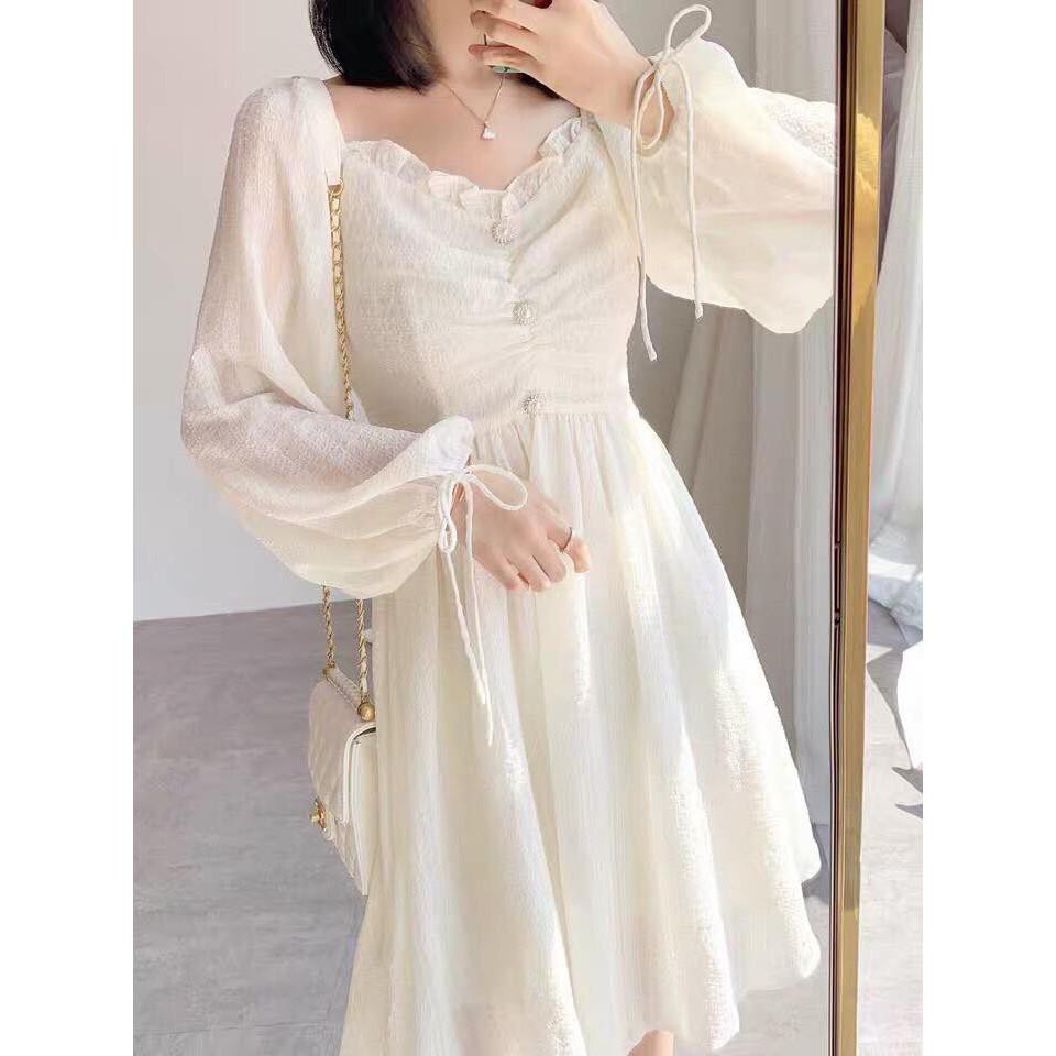 Đầm midi trắng nhún ngực đính ngọc tay bồng