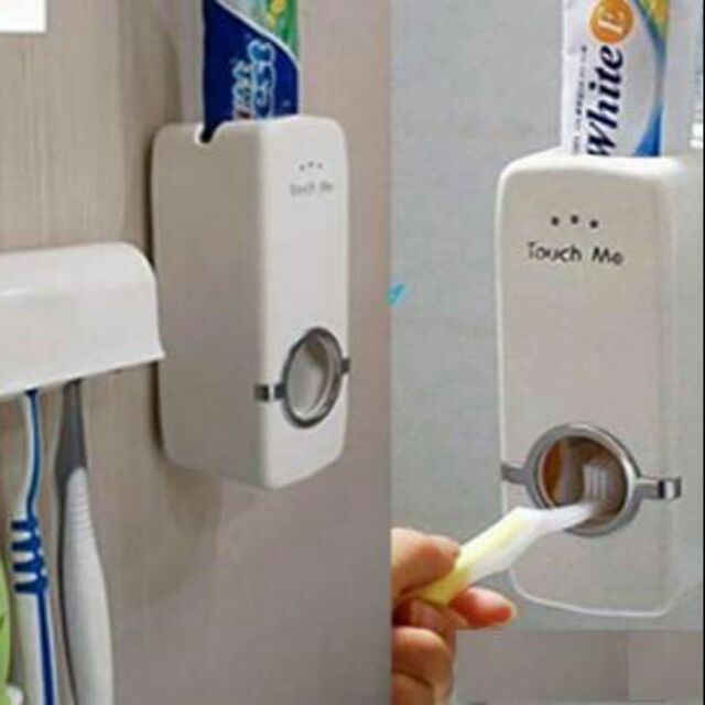 Dụng cụ lấy kem đánh tăng tự động Touch Me bao gồm: Một hộp đựng kem đánh răng tự động, một giá để bàn chải đánh răng