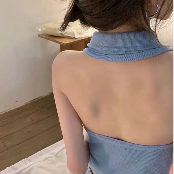 Young fashionable lady sleeveless vest top