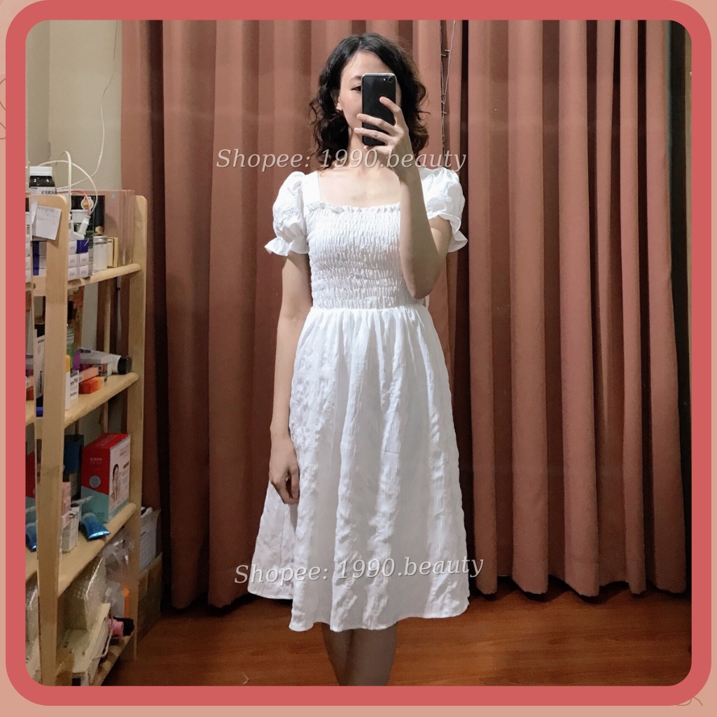Váy nữ tiểu thư đầm nữ sang chảnh cổ vuông tay bồng thắt dây sau váy babydoll chun ngực chun tay nơ sau điệu đà màu trắn