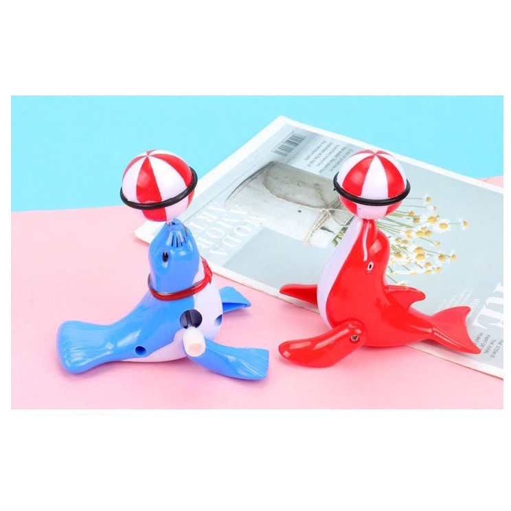 Đồ chơi vặn cót hải cẩu xoay bóng vặn cót 6.7*6.5cm DUASHOP.