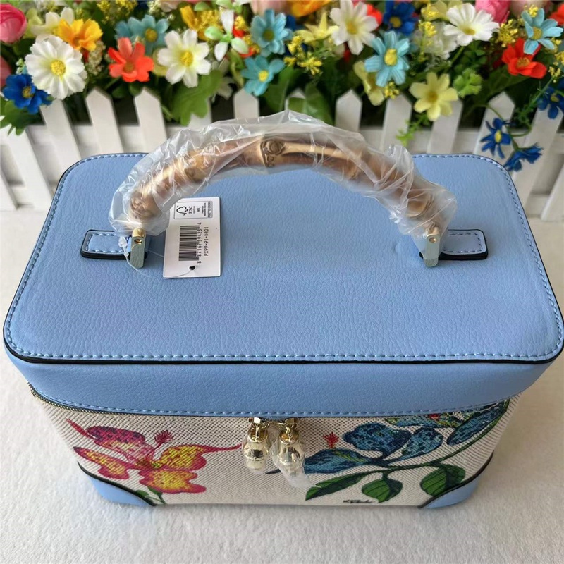 Túi Đựng Mỹ Phẩm Cầm Tay Màu Be In Họa Tiết Thời Trang Tiện Lợi