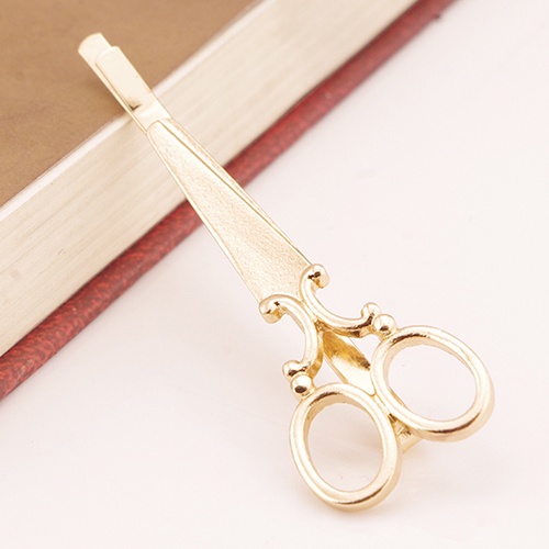 Kẹp tóc màu vàng đồng thời trang nữ tính