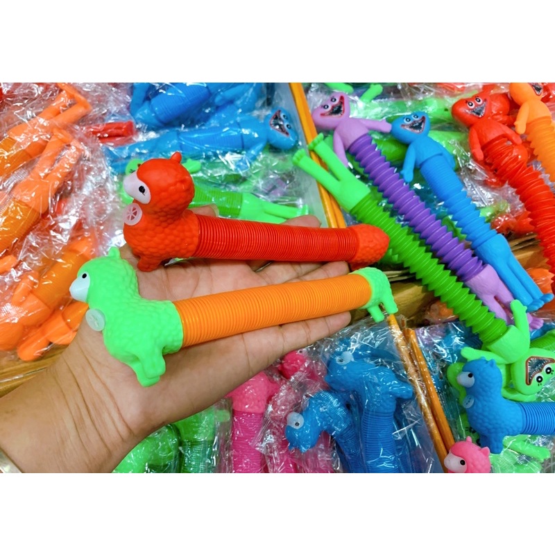 Ống lò xo kéo dài thu gọn Huggy Wuggy, Unicorn, Cún Xúc Xích, Lạc Đà đồ chơi cho bé