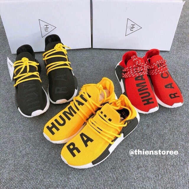 Giày Adidas NMD Human race đen vàng đỏ