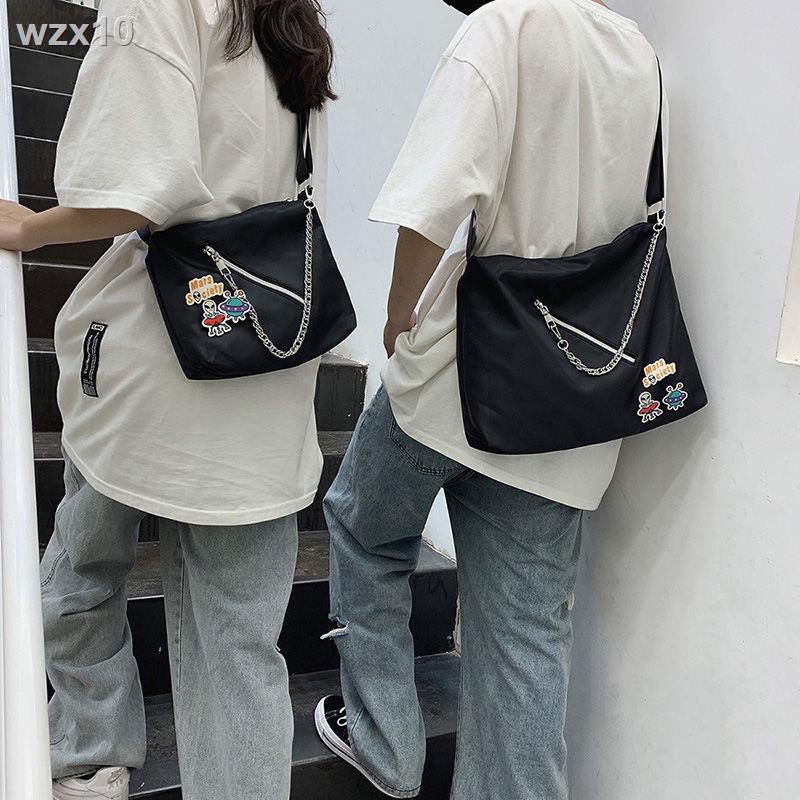 Túi xách của nam giới dung tích lớn đơn giản màu tinh khiết dị sinh viên Nhật Bản nữ thời trang thương hiệu ba lô