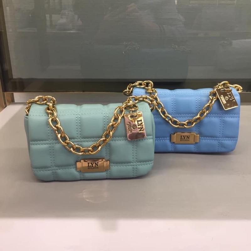 Túi lyn đeo chéo khoá xoay