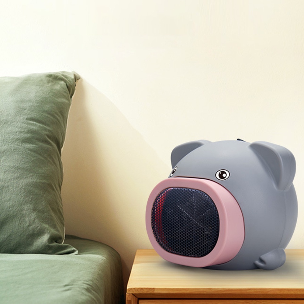 1 dụng cụ sưởi ấm bằng điện hình chú heo đáng yêu