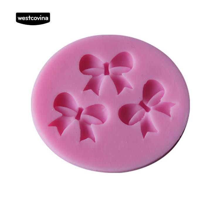 Khuôn silicone màu hồng họa tiết nơ trang trí bánh