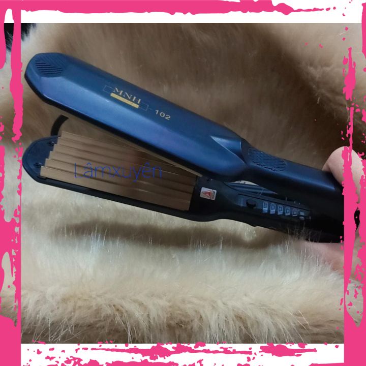 Máy bấm tóc MNH-102 bấm tóc xù đẹp,mềm bóng đẹp với chất liệu thép titan giúp Máy bấm êm, nhanh, không rít tóc