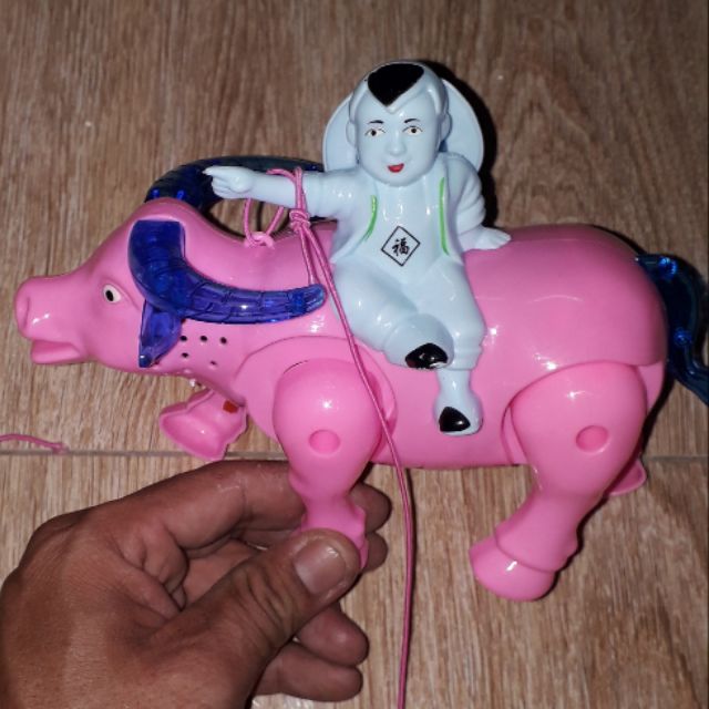 Một mô hình chú bé chăn trâu bằng nhựa có nhạc và đèn Led rất đẹp _tặng kèm pin