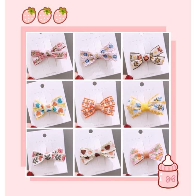 Kẹp nơ vải hoa thêu 4cm cho bé
