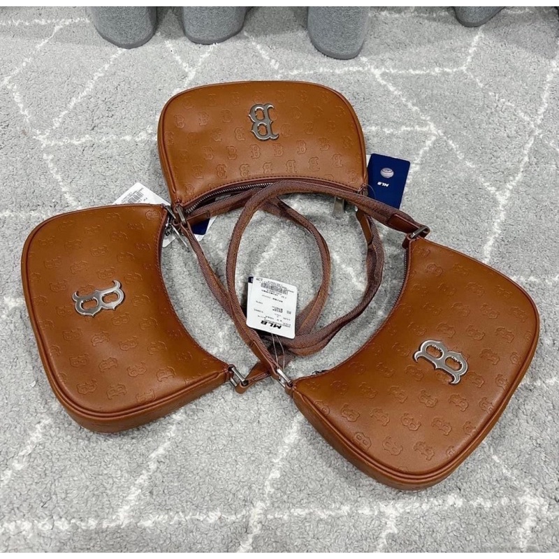 Túi kẹp nách da hoạ tiết monogram chìm