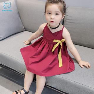 Đầm công chúa sát nách màu trơn đính ruy băng cho bé