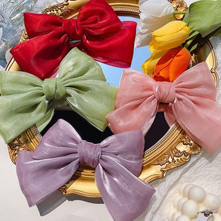 Kẹp tóc nơ lụa ánh kim Tet holiday