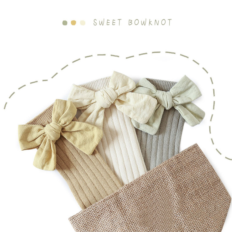 Đôi tất chân cotton dài đính nơ dễ thương cho bé